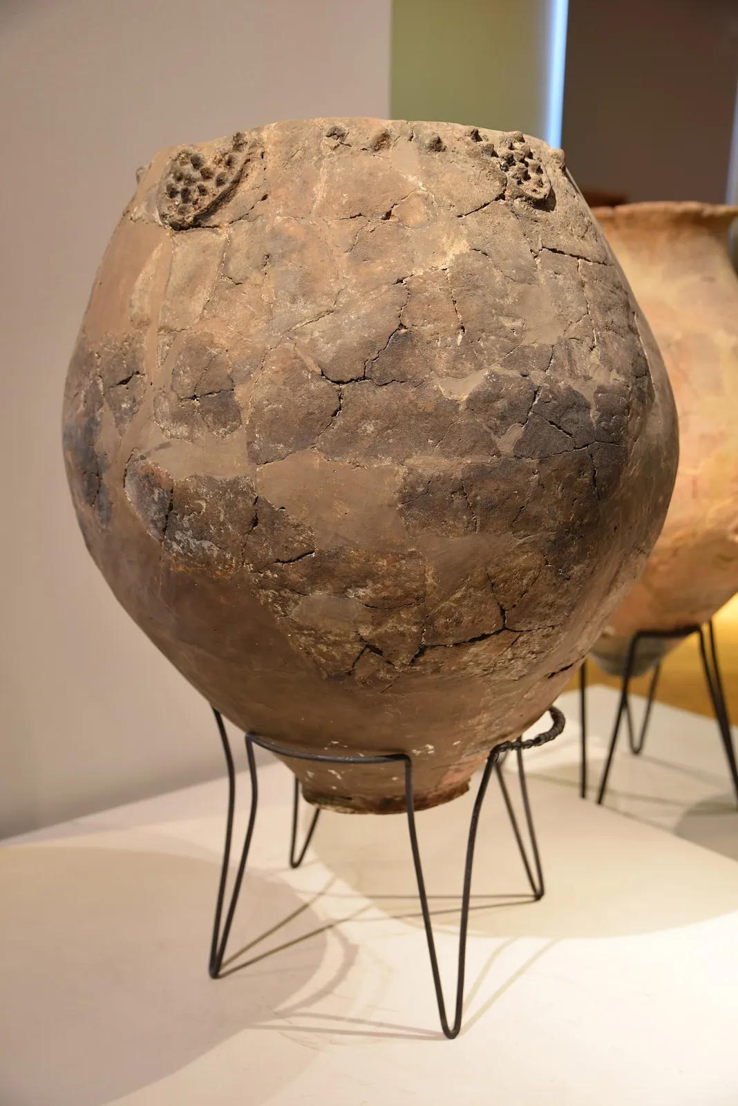 Large decorated clay wine jar from around 6000 BC on display at the National Museum of Georgia